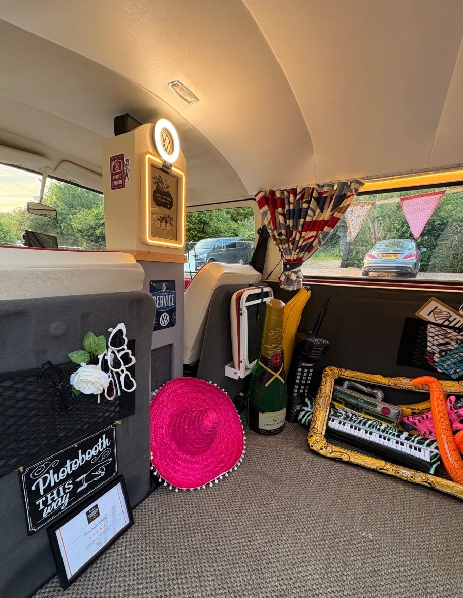 campervan photobooth interior Interior of a vehicle featuring decor, textiles, and various objects for a vibrant atmosphere.