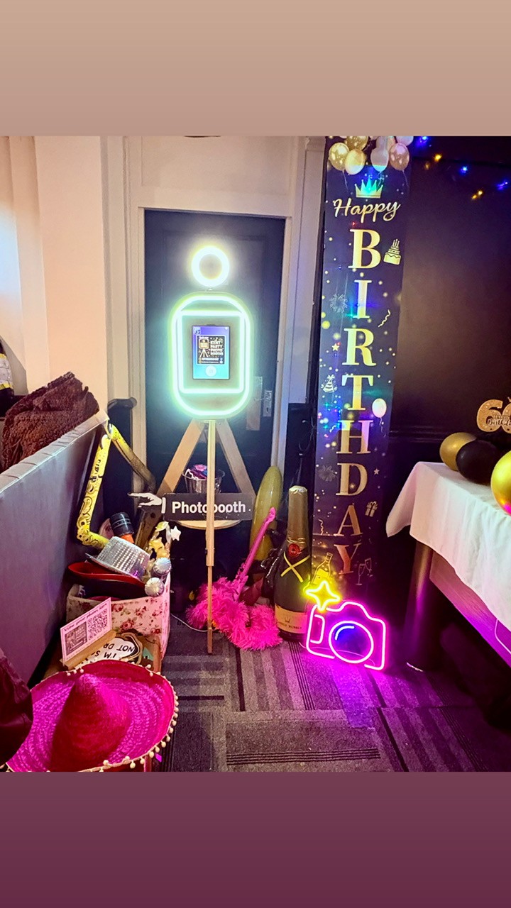 Birthday party photo booth A vibrant birthday celebration setup with decorations and props.